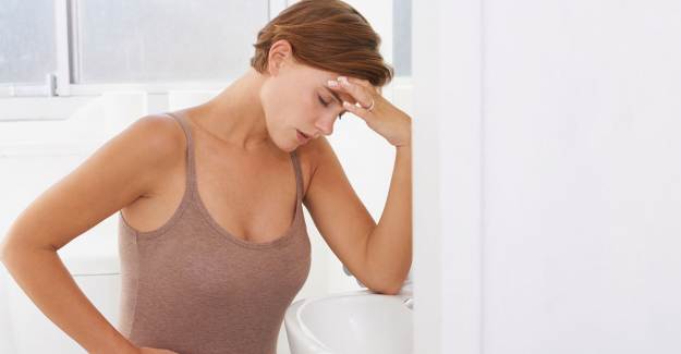 Тошнота перед месячными у женщин: причины и лечение